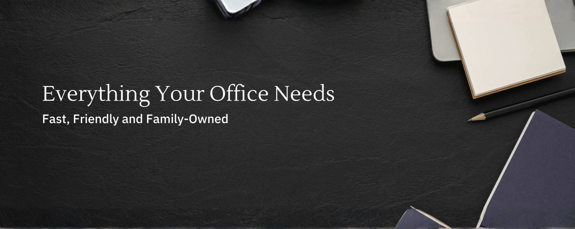 A black leather bag with the words " your office needs to be owned " Office.